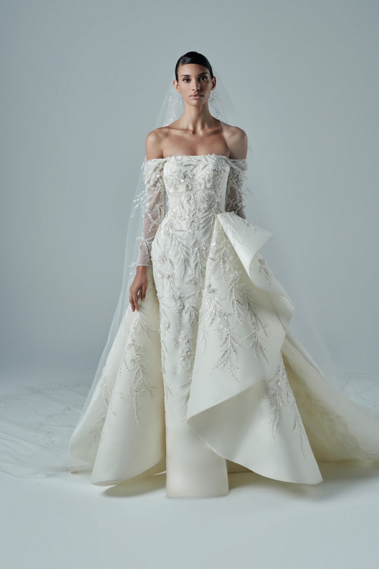 Fully beaded tubino off the shoulder bridal dress, with structured over skirt.